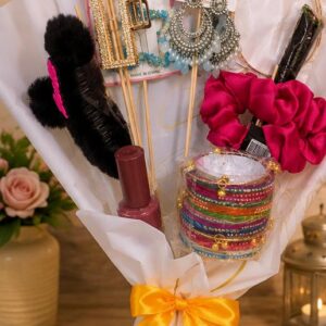 Handmade makeup and cosmetic gift bouquet with yellow ribbon by Binte Tariq